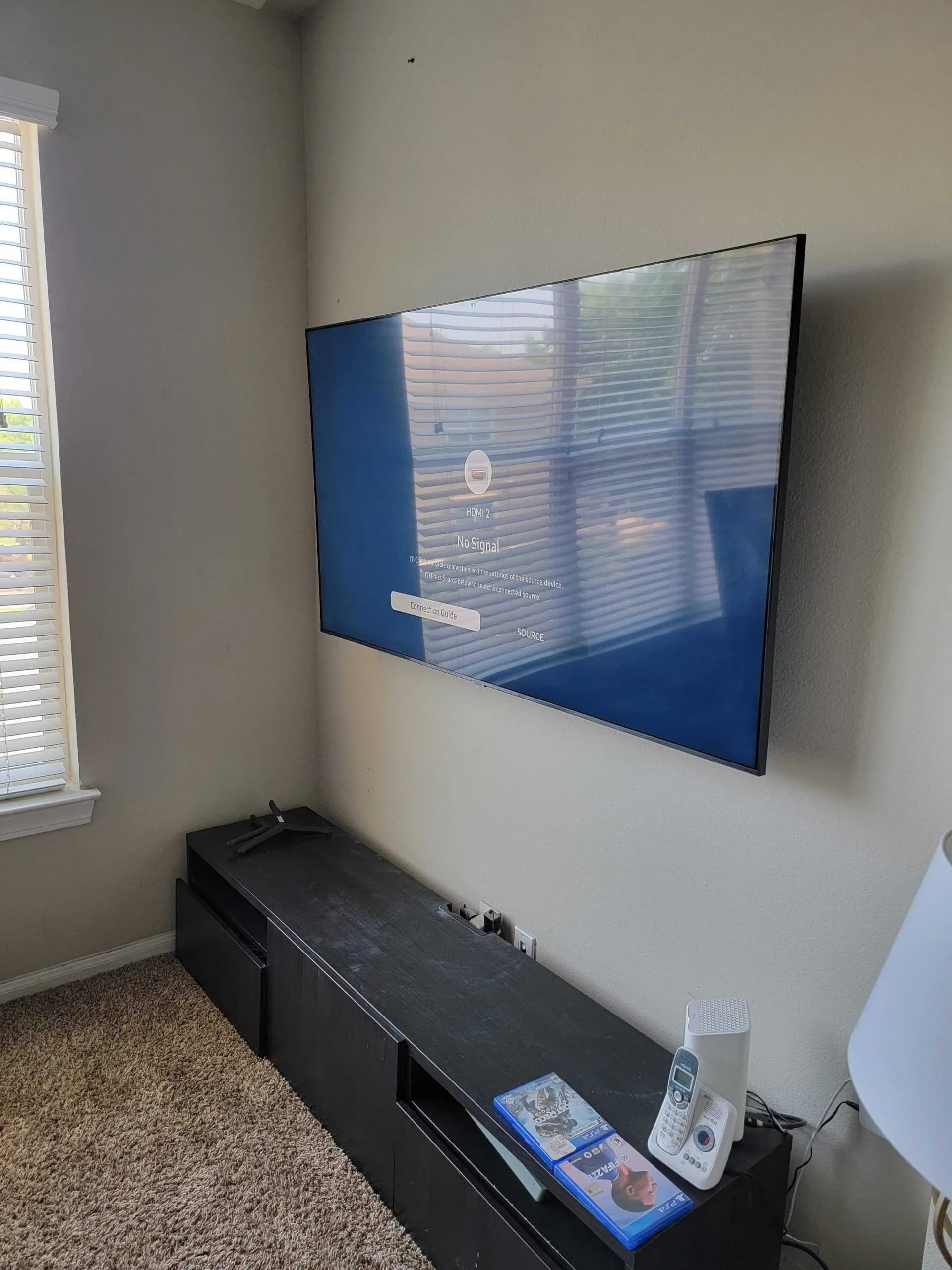 Large TV on corner full-motion mount