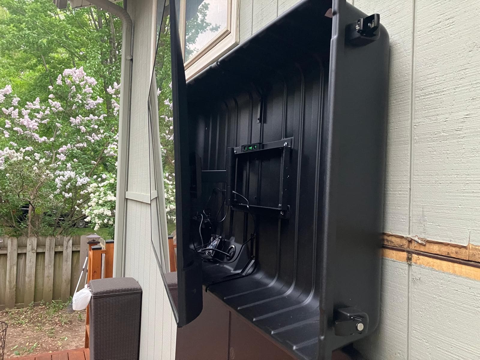 Outdoor enclosure open showing clean mount hardware and cable routing